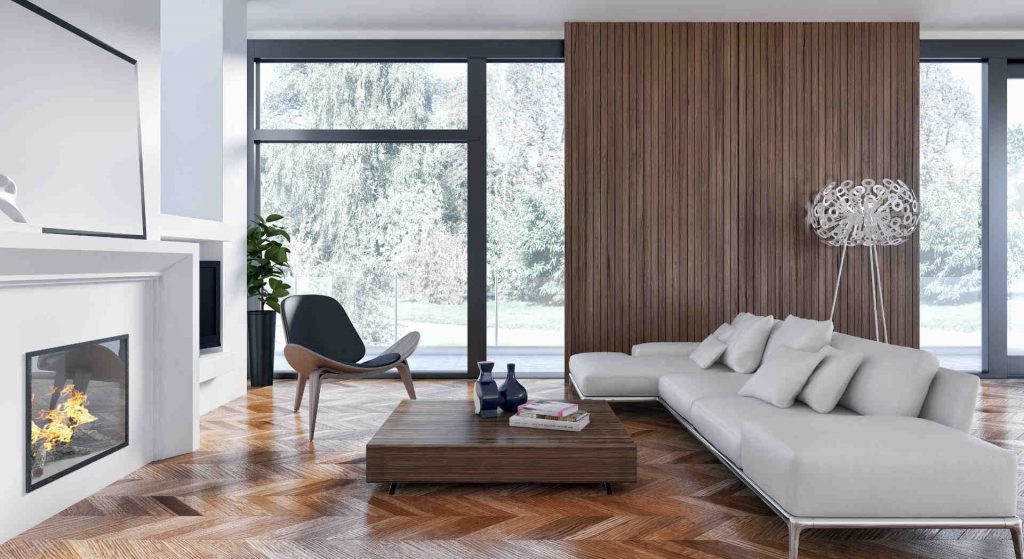 christian-fexer-immobilien-wuerzburg-wohnraum-parkett-brauner-chouchtisch-braune-Wand-offener-kamin